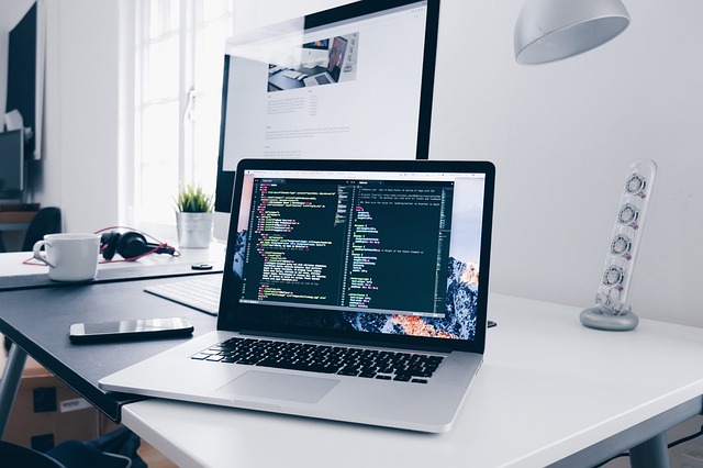 modern office environment with technology screens displaying AI analytics and software trends